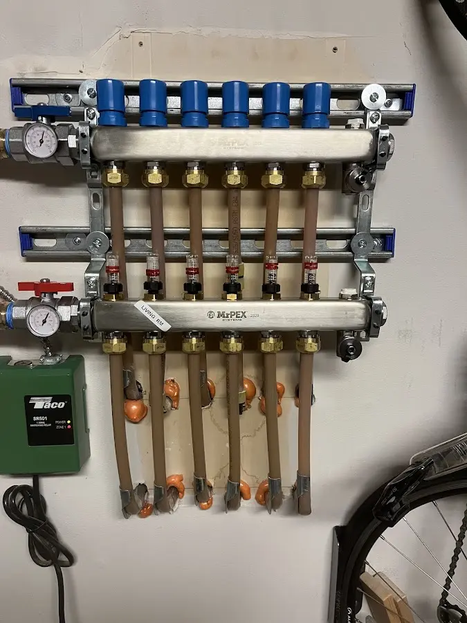 Plumber performing Water Heater Repair at a residential property in North Liberty